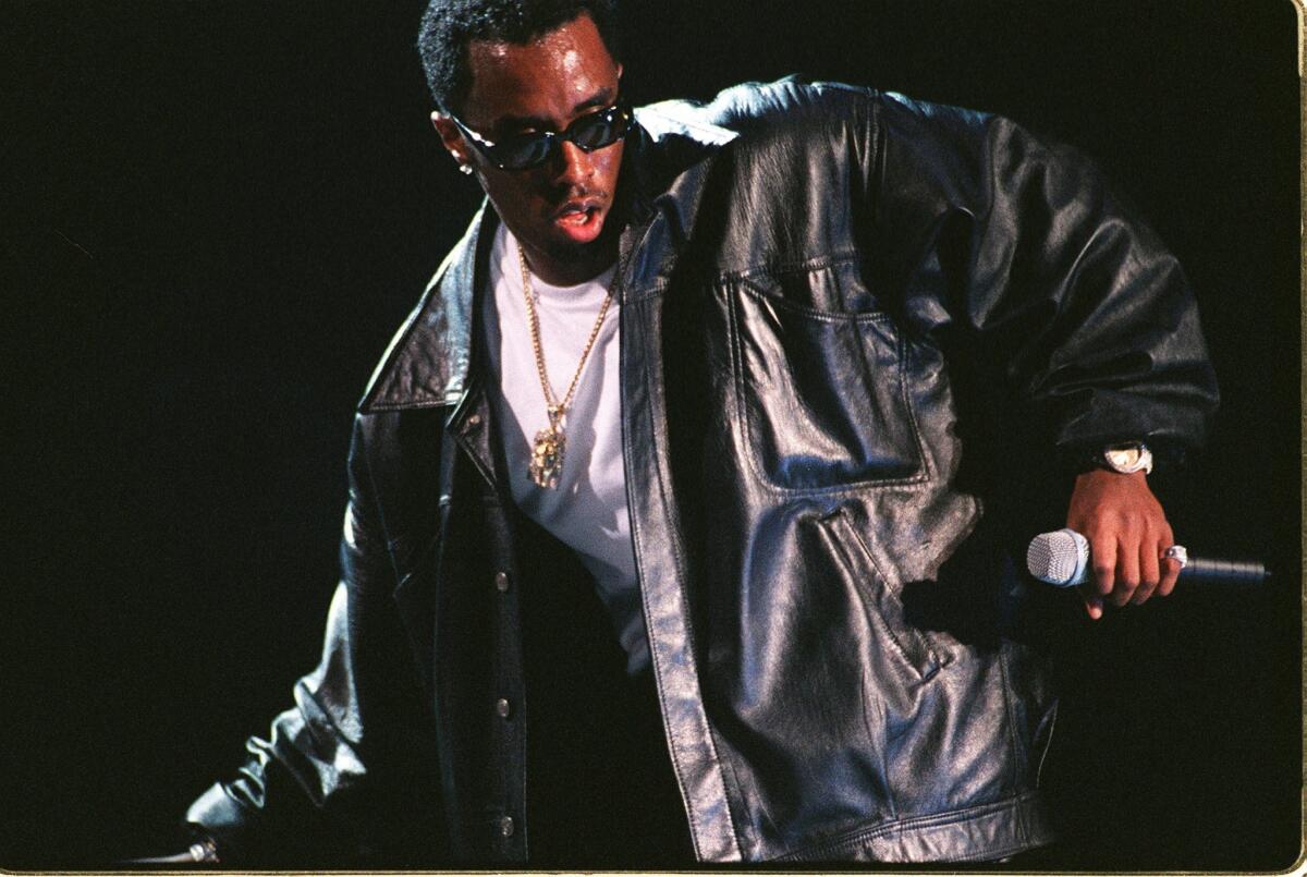 Bad Boy Records founder Puff Daddy performs at New York's Madison Square Garden in 1997.