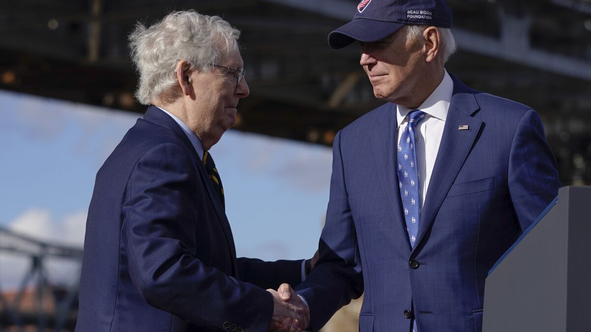 As House Republicans squabble, Biden and McConnell shake hands