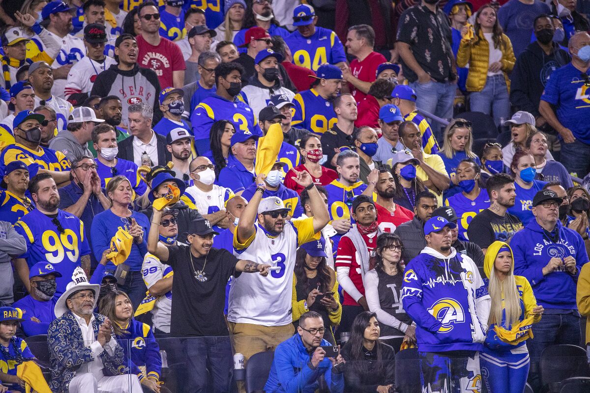 Rams and 49ers fans watch the game during the Rams' 20-17 victory over San Francisco in the NFC championship game.