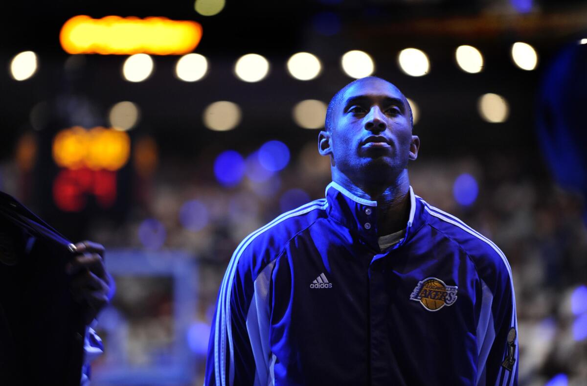 Kobe Bryant listens to the national anthem before Game 3 of the 2009 NBA Finals in Orlando, Fla.