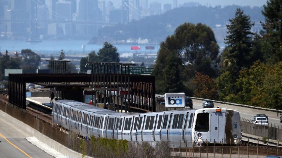 A Bay Area Rapid Transit train pulls away from the Rockridge station in Oakland in August 2013.