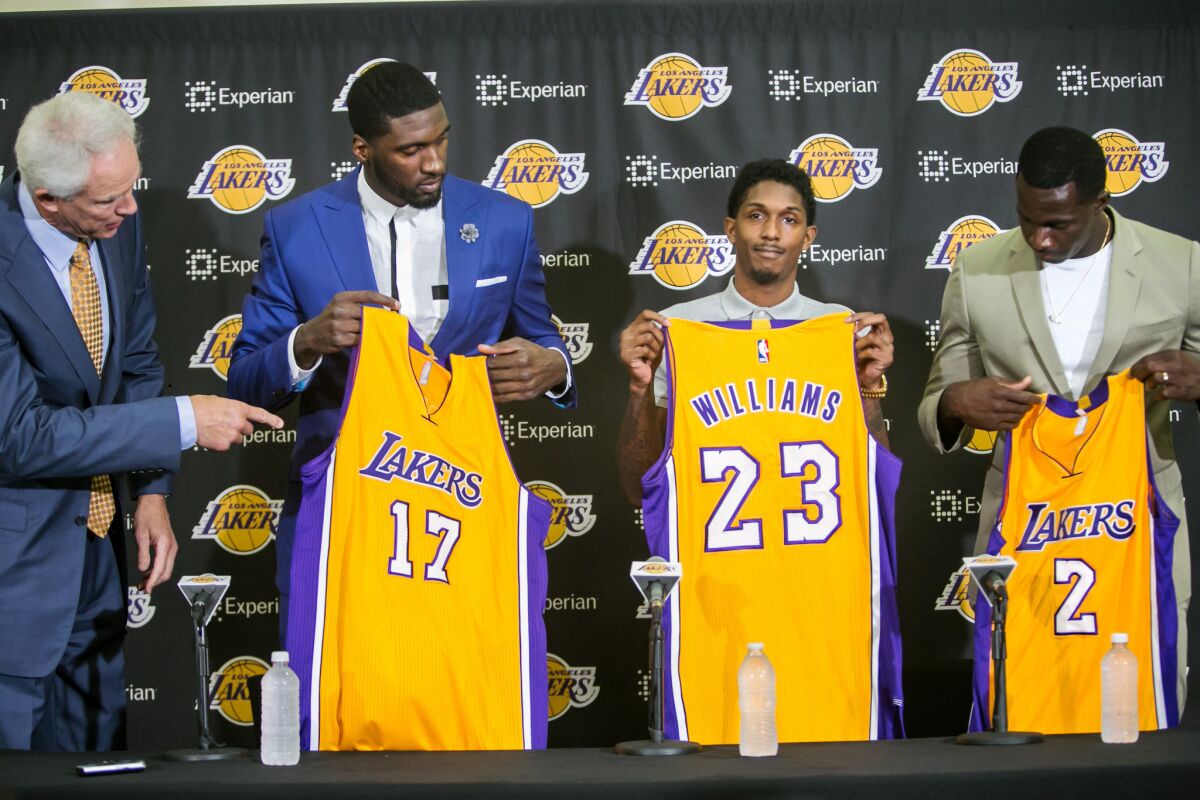 Lakers General Manager Mitch Kupchak introduces veteran free-agent acquisitions (from left) Roy Hibbert, Lou Williams and Brandon Bass in July at the team's practice facility in El Segundo.