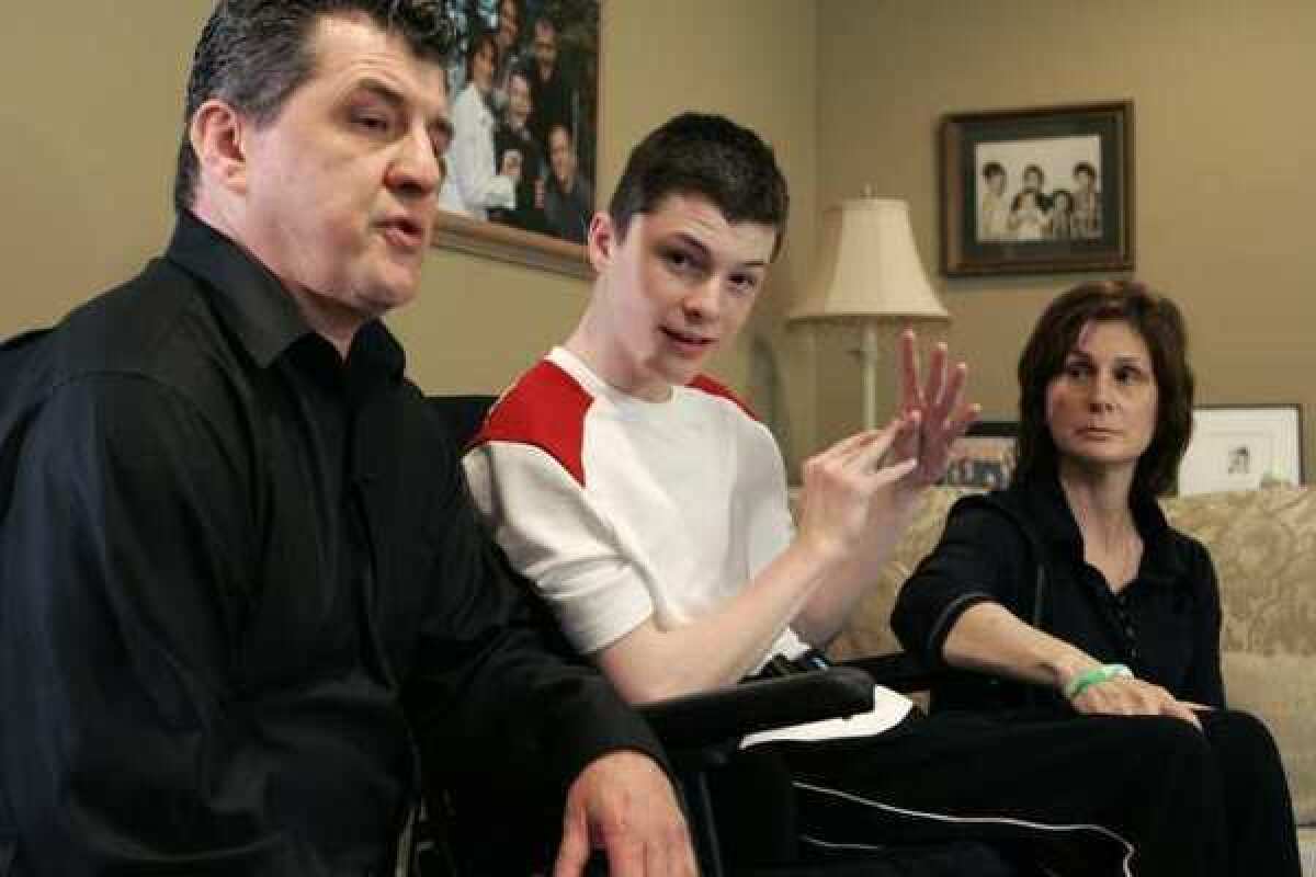 Steven Domalewski, now 18, shown with his parents Joseph and Nancy, was left brain-damaged after being struck by a line drive while playing in a youth baseball game in 2006.