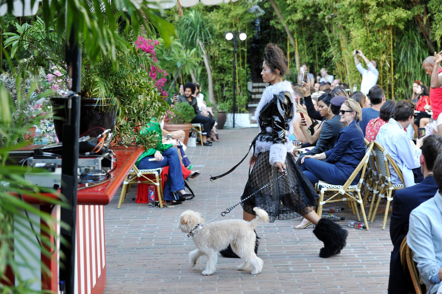 A model walks the dog in a look from CFDA/Vogue Fashion Fun finalist Sandy Liang's eponymous collection at the Oct. 25 event at the Chateau Marmont.