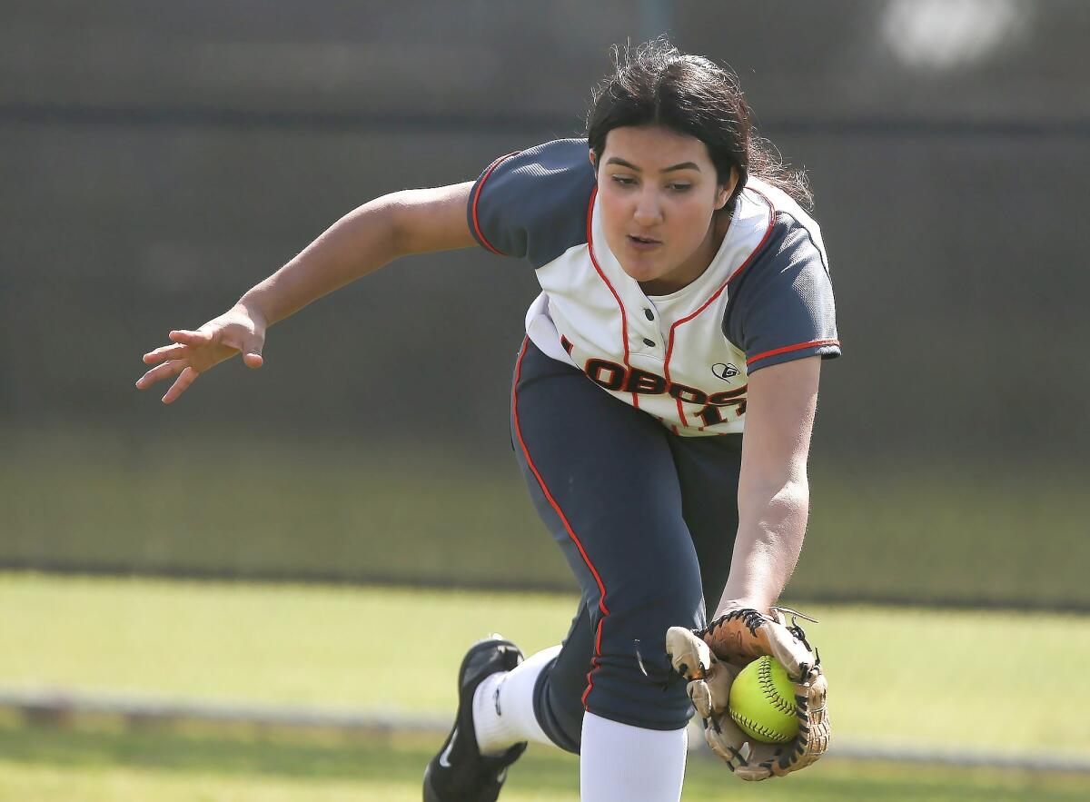 Los Amigos High right fielder Alondra Perez runs down a line drive for an out in a Garden Grove League game against Loara on Tuesday.