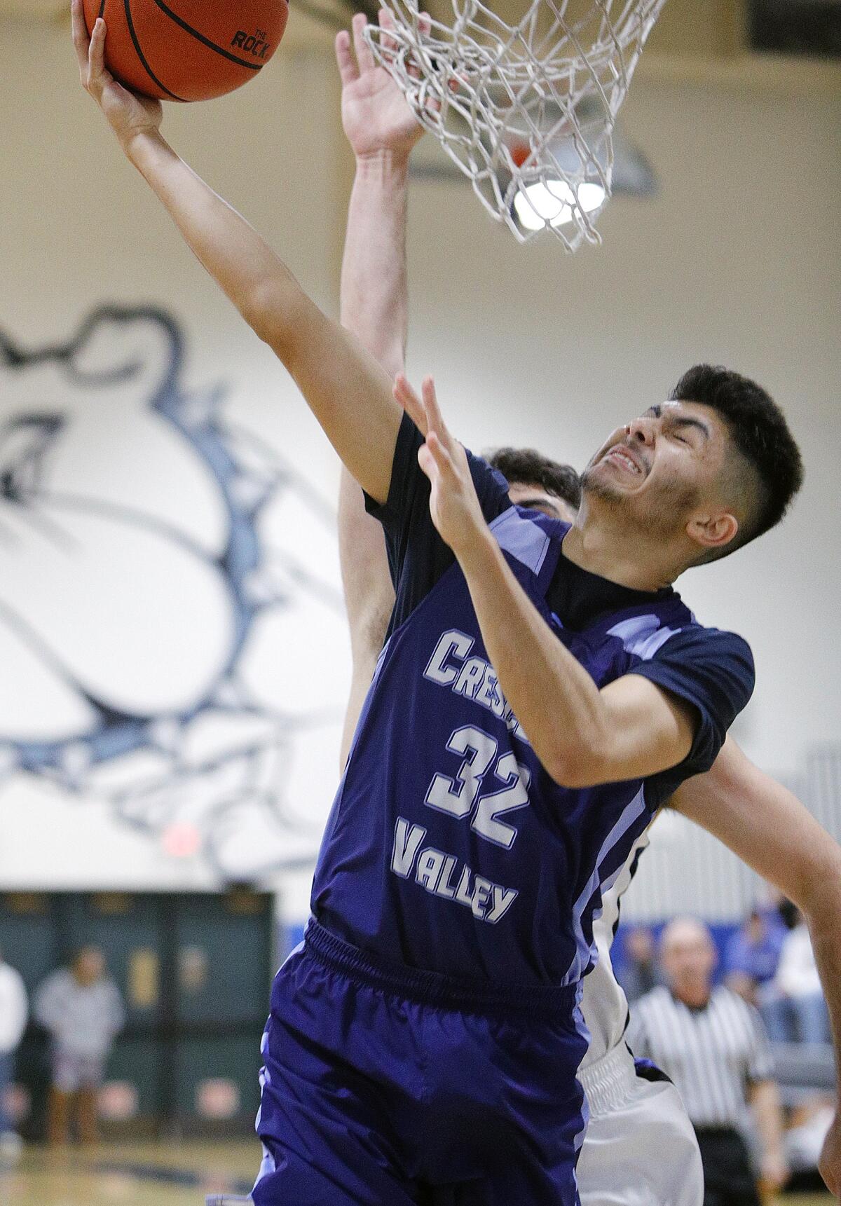 Crescenta Valley's Alec Voskanian shoots against Burbank's Kevin Sarkes in a Pacific League boys' basketball game at Burbank High School on Thursday, December 19, 2019.