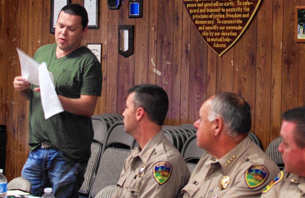 Ryan Jackson, Hoopa Valley tribal chairman, speaks at a meeting with Humboldt County sheriff's officials, including Sheriff Mike Downey, second from right. The tribal council has approved a $1.7-million law enforcement budget for 2016 — a nearly $500,000 increase over last year. The tribe is also pursuing other avenues to gain greater law enforcement authority on their lands.