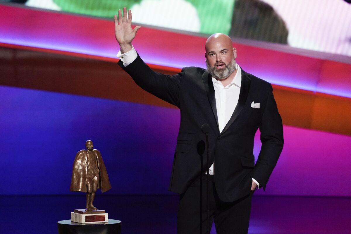 Andrew Whitworth of the Los Angeles Rams receives the NFL Man of the Year Award at the NFL Honors show Thursday, Feb. 10, 2022, in Inglewood, Calif. (AP Photo/Mark J. Terrill)