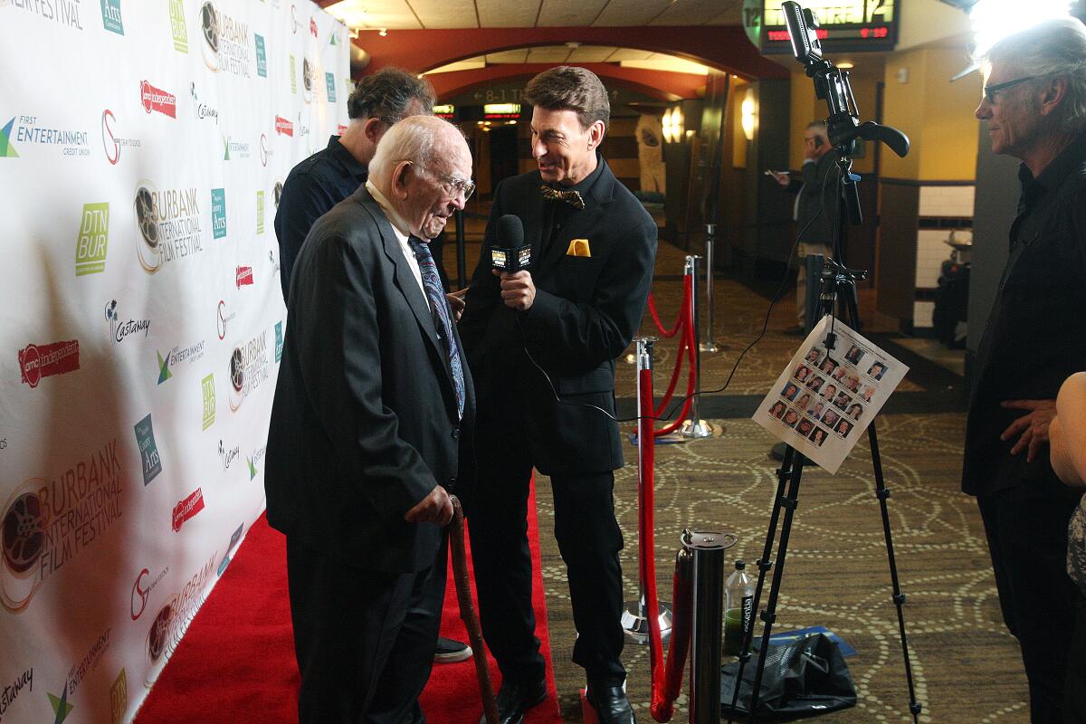 Actor Ed Asner stands at the red-carpet event on the opening night of the 11th annual Burbank International Film Festival at the AMC Burbank 16 theaters in Burbank on Wednesday. He received the festival's Lifetime Achievement Award. More than 180 films will be presented between Sept. 5 and 8.