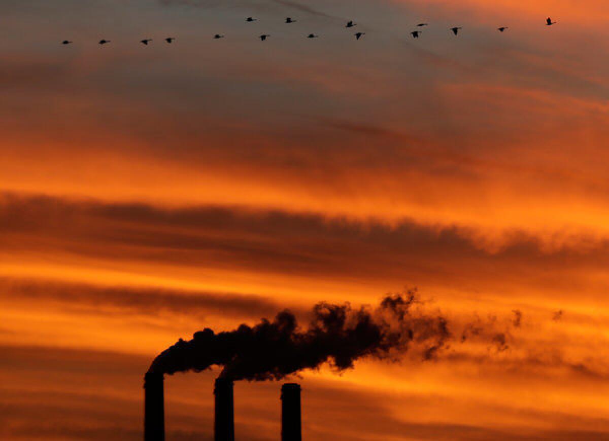 Smokestacks at the Jeffrey Energy Center coal power plant at sunset near Emmett, Kan.
