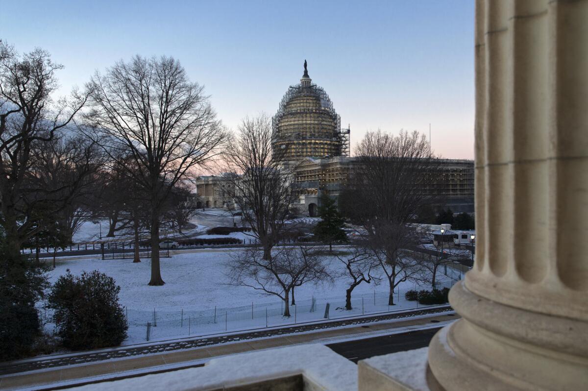 A snow-dusted Capitol Hill in Washington early Thursday.