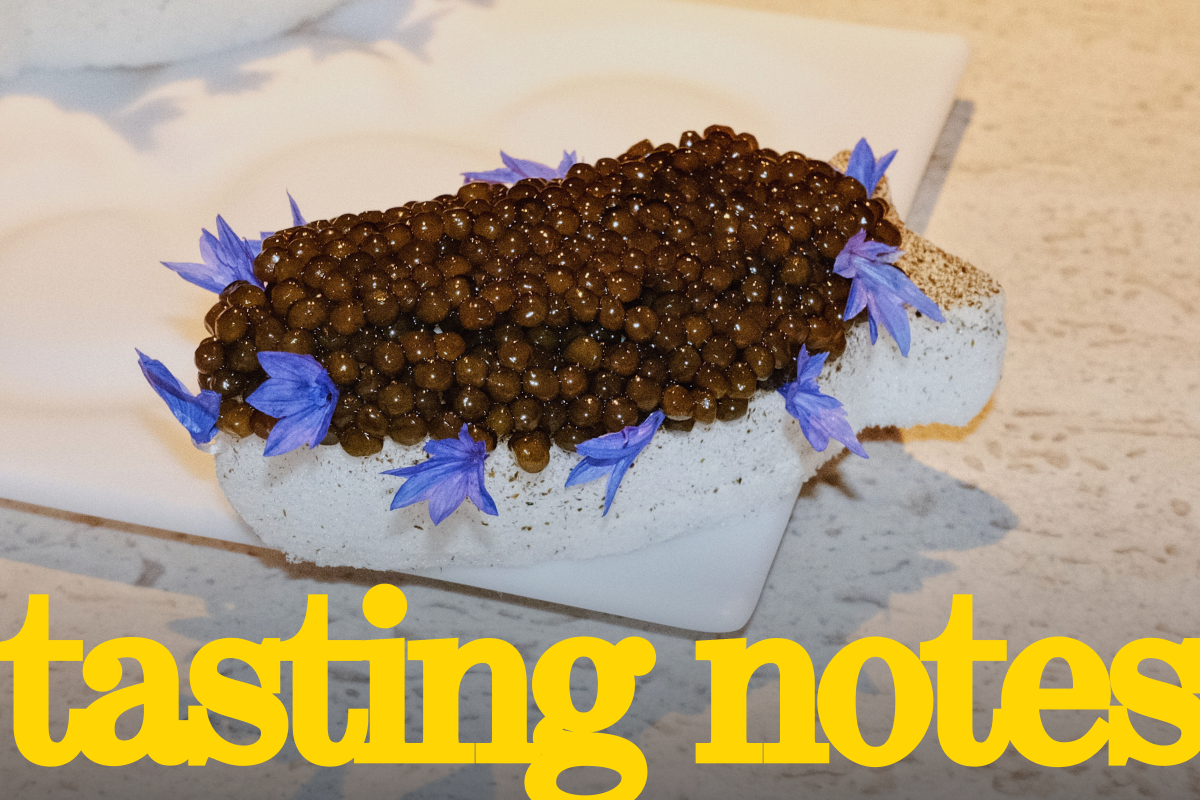 A savory course of caviar atop fish-shaped nori meringue