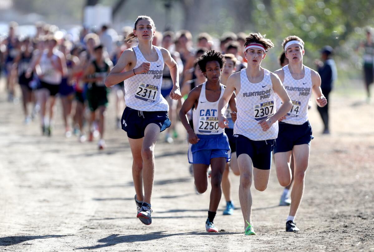 Flintridge Prep won the boys division 5 CIF Southern Section Cross Country Finals, at Riverside City Cross-Country Course in Riverside on Saturday, Nov. 23, 2019. Left to right are juniors Hudson Billock, Bennett Oakes and Nolan Costin.