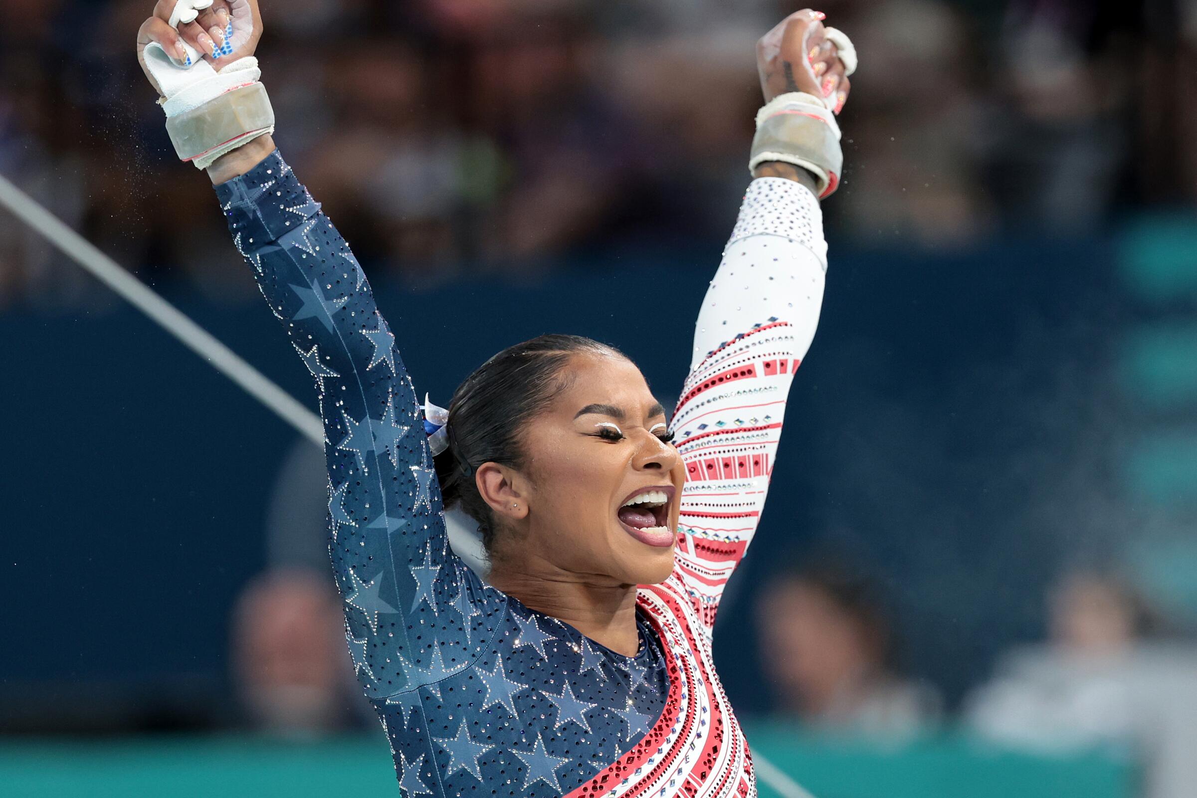 American Jordan Chiles celebrates after completing her uneven bars routine 