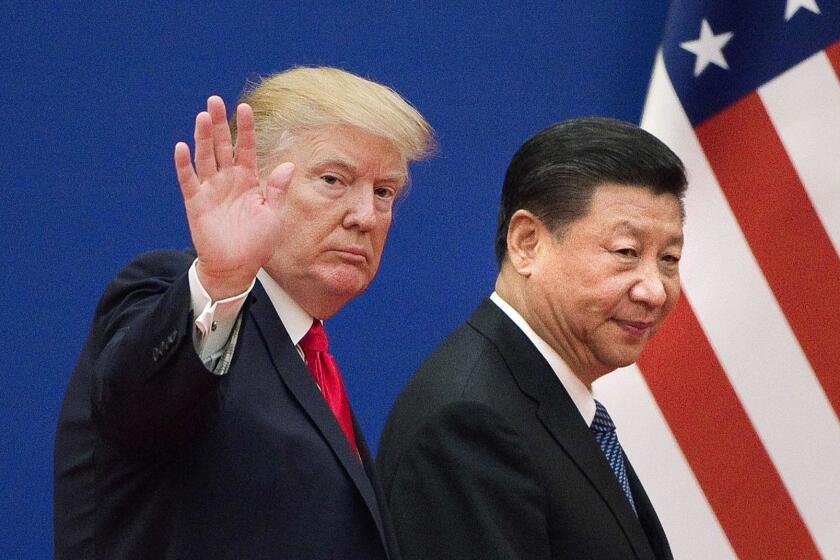 (FILES) This file picture taken on November 9, 2017 shows US President Donald Trump (L) and China's President Xi Jinping leaving a business leaders event at the Great Hall of the People in Beijing. - US President Donald Trump on March 1, 2019, urged China to abolish tariffs on agricultural products imported from the United States -- adding that trade talks between the rival powers were going well. "I have asked China to immediately remove all Tariffs on our agricultural products (including beef, pork, etc.)," the president wrote on Twitter. (Photo by Nicolas ASFOURI / AFP)NICOLAS ASFOURI/AFP/Getty Images ** OUTS - ELSENT, FPG, CM - OUTS * NM, PH, VA if sourced by CT, LA or MoD **