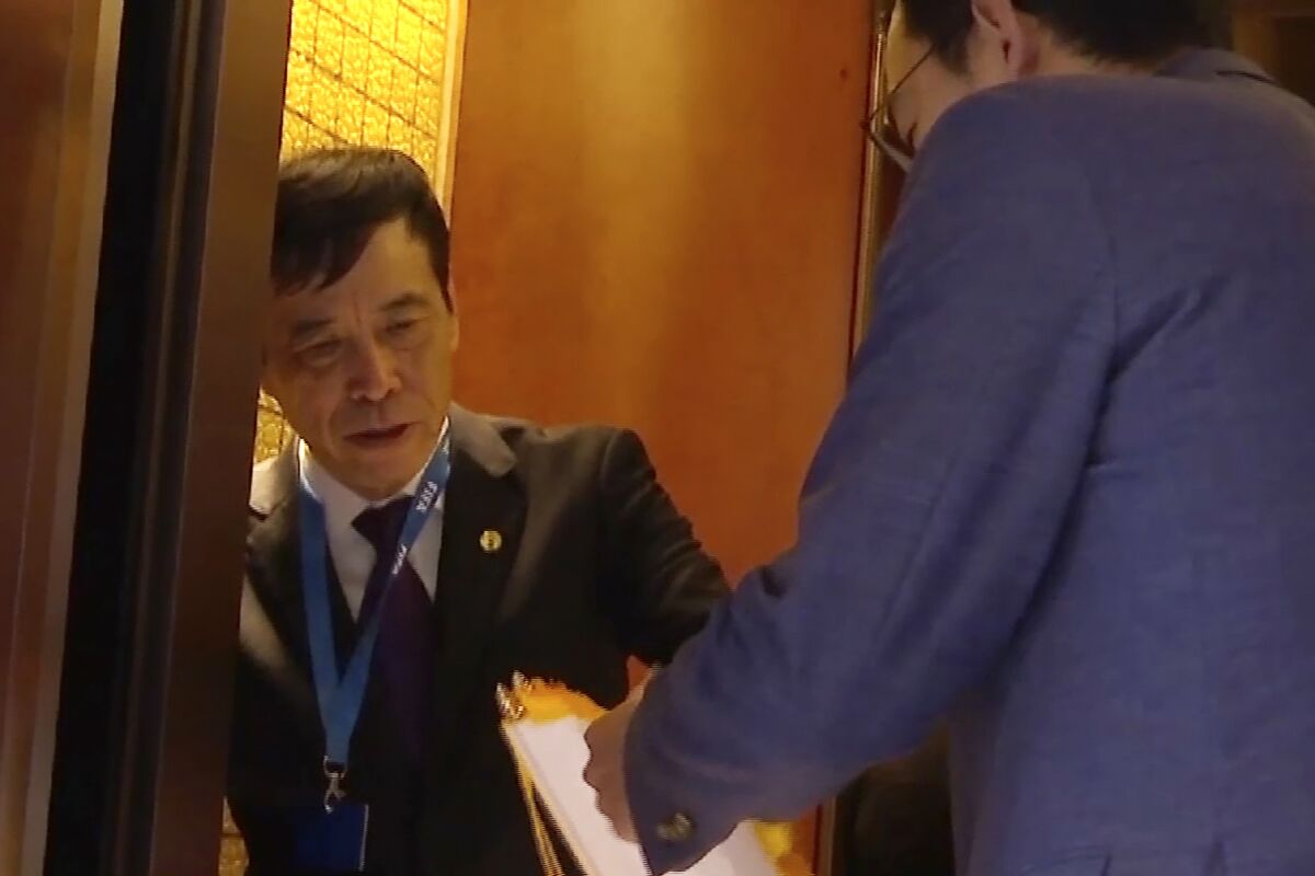 FILE - In this image made from video, Chen Xuyuan, head of the Chinese Football Association, gets on an elevator in Shanghai, Oct. 24, 2019. China’s scandal-plagued official Football Association has been rocked by new corruption probes into its chiefs of discipline and competition. (AP Photo, File)