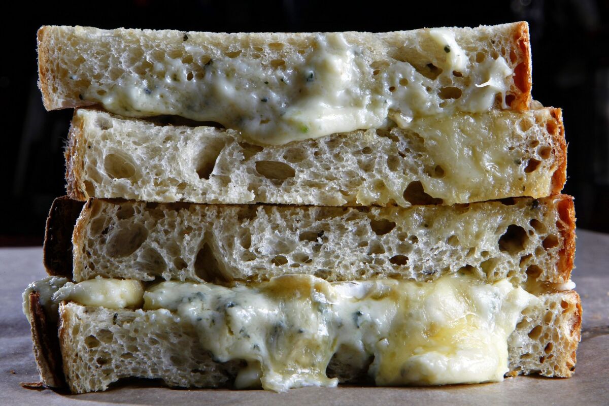 Shown here is the bakery's Almost Grilled Cheese, which featured triple cream French brie and crumbled Gorgonzola cheese on oven-toasted rosemary olive oil bread. It regularly offered more than 20 varieties of handmade artisan bread.