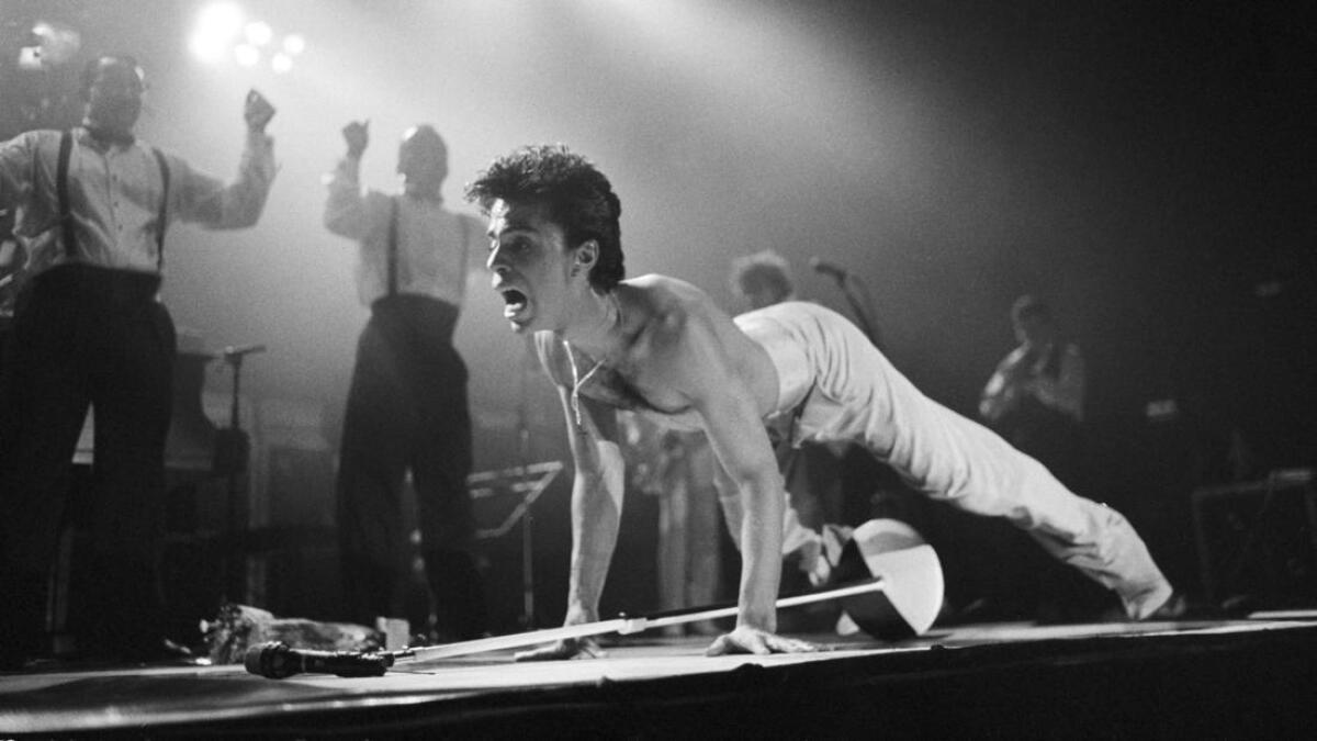 Prince performs on stage on the Hit N Run-Parade Tour at Wembley Arena in London in August 1986.