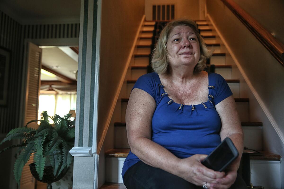 JoDell Pasek fights back tears as she talks about her son Andrew, 25, who was electrocuted while trying to rescue his sister's cat in a flooded West Houston neighborhood.