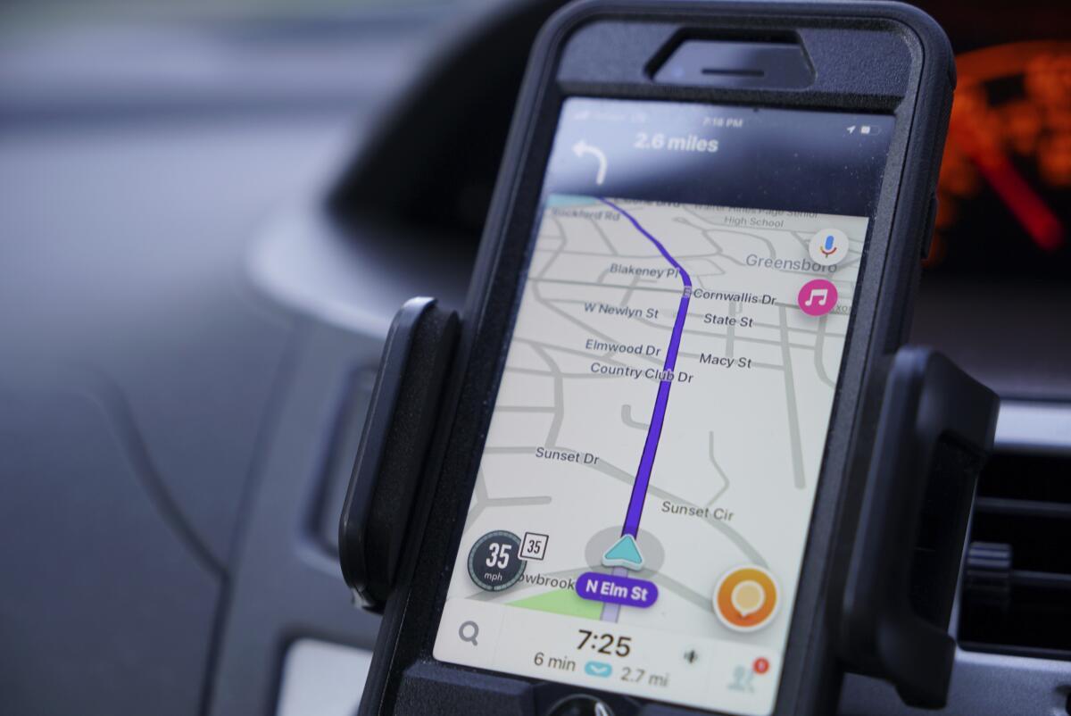 The Waze navigation app is used.