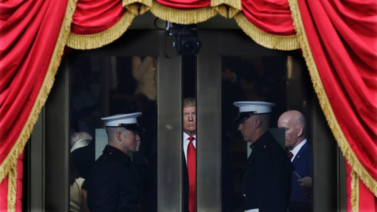 Then-President-elect Donald Trump waits to step out onto the West Front of the U.S. Capitol to be inaugurated on Jan. 20, 2017.