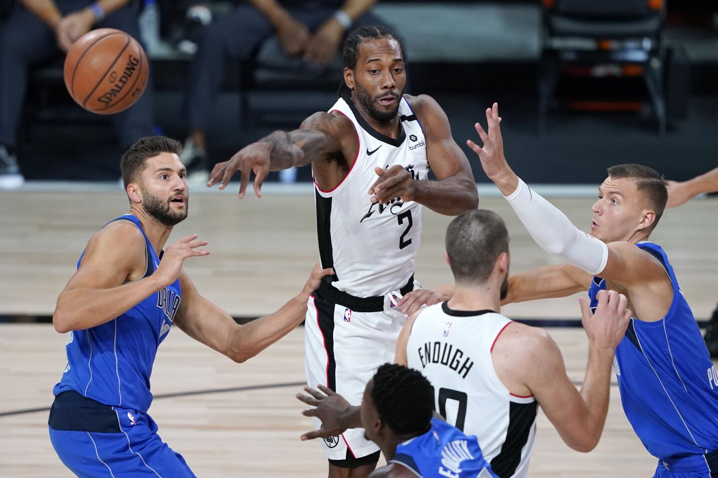 Clippers forward Kawhi Leonard passes the ball during the first half of Game 3.