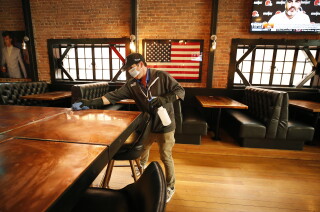 California's coronavirus case rate now the lowest in the
continental U.S. 3 SAN LUIS OBISPO, CA - MARCH 03: Chris Finefrock sanitizes the bar as part of the sanitation team cleaning the Finney's Crafthouse & Kitchen in downtown San Luis Obispo as they prepare to open for indoor dinning as San Luis Obispo county moved into the red tier that allows for indoor dining and gym reopening. The Finefrock family owned business has four locations in Southern California. Chris said, "We clean and sanitize each location so customers can feel comfortable inside." downtown on Wednesday, March 3, 2021 in San Luis Obispo, CA. (Al Seib / Los Angeles Times).