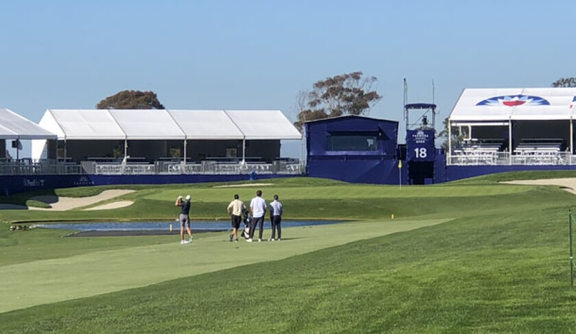 A golfer hits onto the 18th green on Torrey Pines' South Course during Monday practice round for Farmers Insurance Open.