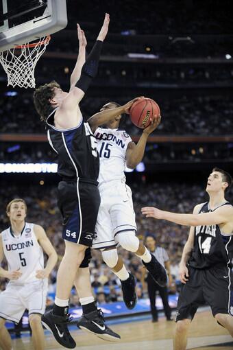UConn guard Kemba Walker drives against Butler center Matt Howard in the first half while UConn takes on Butler in the 2011 NCAA Final Four National Championship in Houston, Texas.