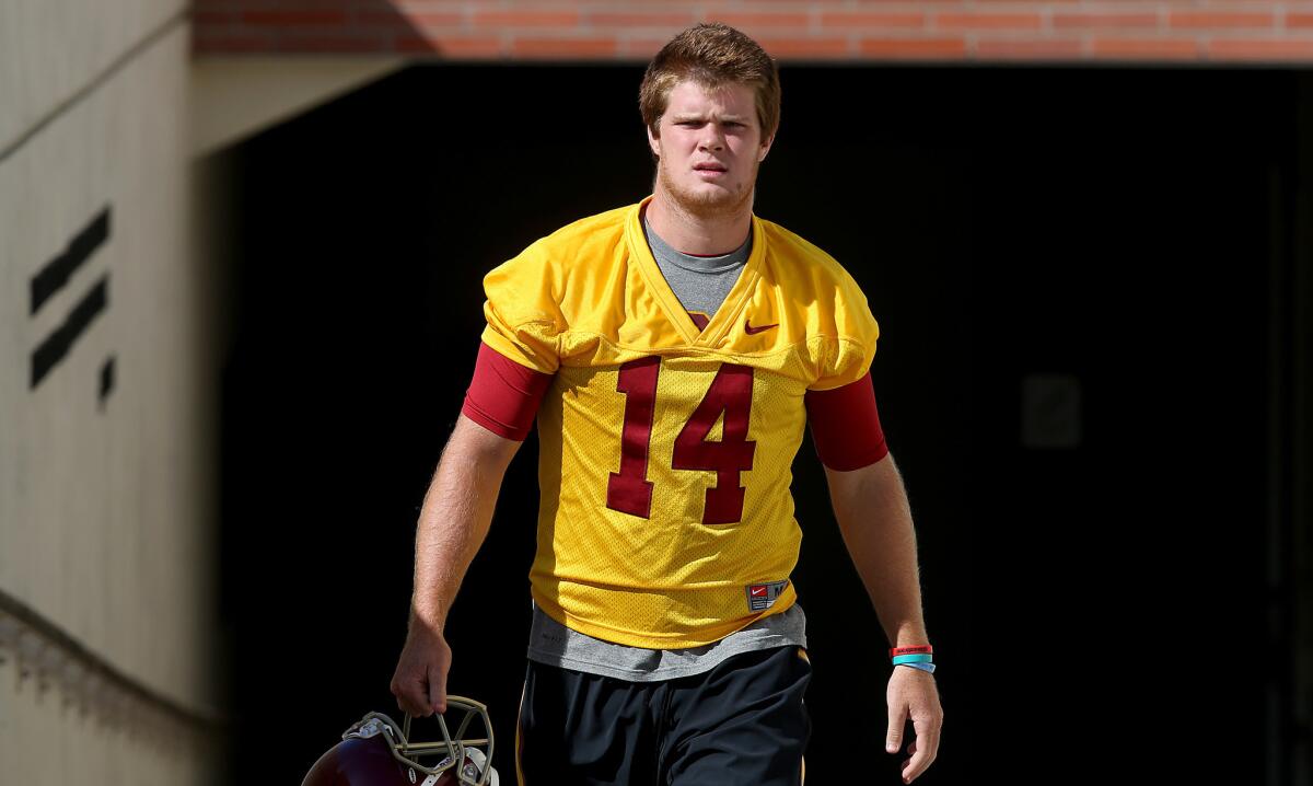 USC quarterback Sam Darnold walks out of the locker room for the first day of training camp practice on Aug. 4.