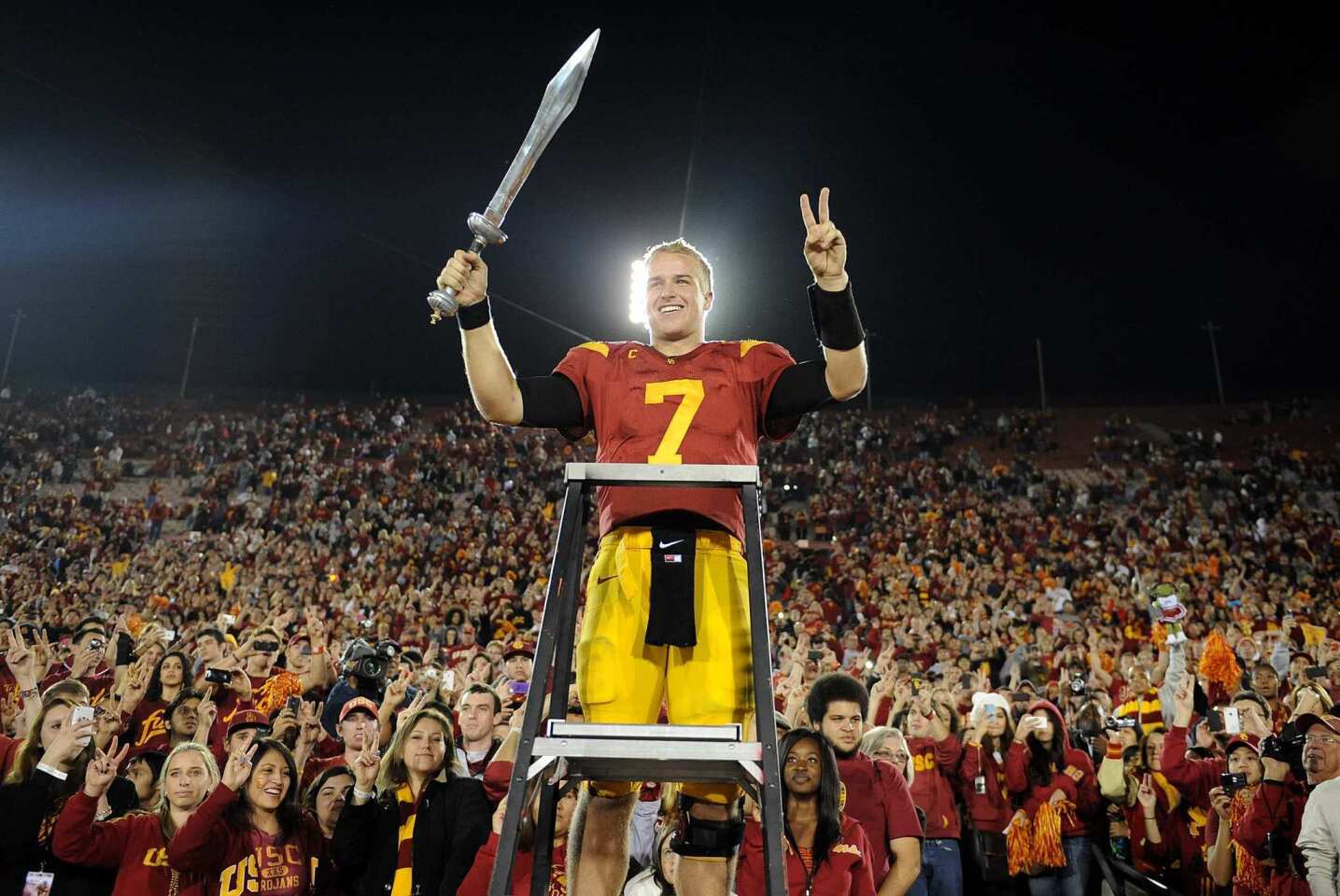 Trojans quarterback Matt Barkley leads the band after defeating UCLA, 50-0, on Saturday night at the Coliseum.