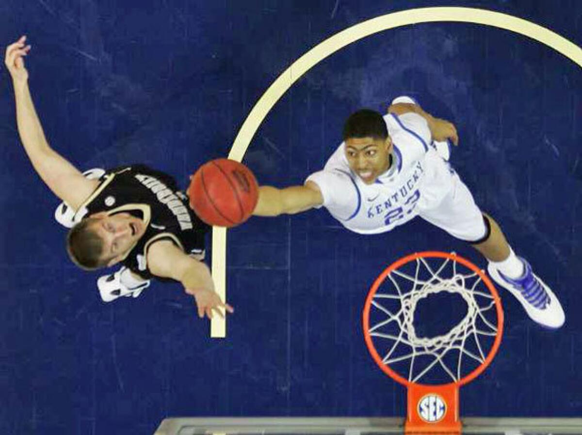 Kentucky's Anthony Davis shoots over Vanderbilt's Brad Tinsley in the SEC tournament final on Sunday. The Commodores upset the Wildcats, 71-64, but Kentucky is still the top seed in the South Regional of the NCAA tournament.