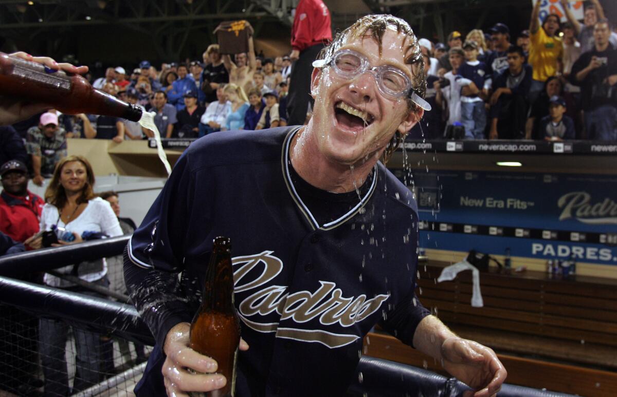 Robert Fick celebrated after the Padres won the NL West in 2005 despite an 82-80 record.