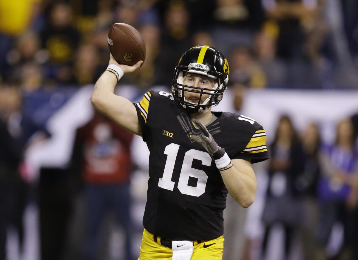 Iowa quarterback C.J. Beathard (16) throws during the second half of the Big Ten Conference championship.