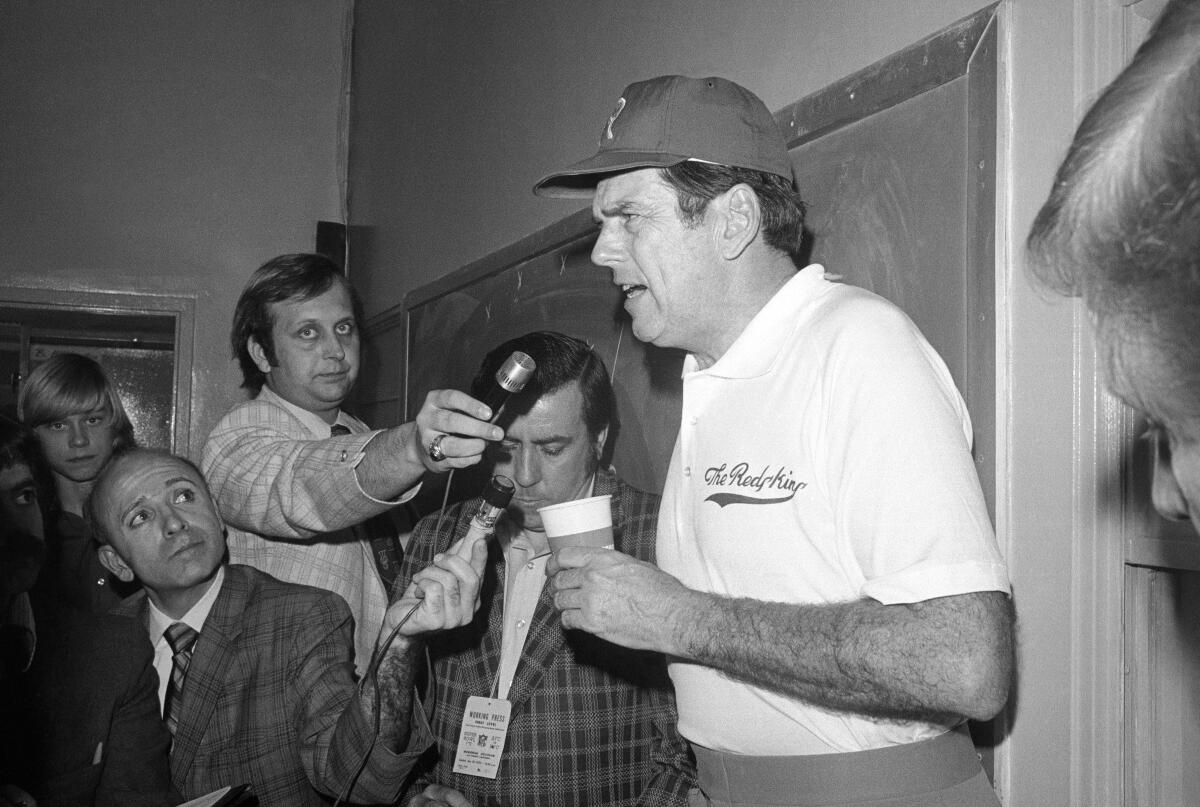 Washington coach George Allen talks to reporters after Super Bowl VII.