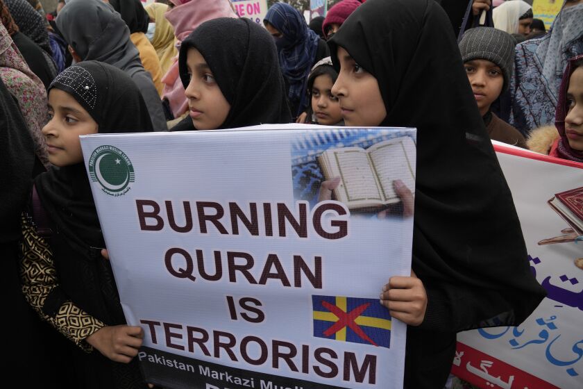 Youngs girls take part in a rally called by 'Muslim Women League' group take part in a rally to denounce the recent desecration of Islam's holy book by far-right activists in Sweden and the Netherlands, in Lahore, Pakistan, Sunday, Jan. 29, 2023. (AP Photo/K.M. Chaudary)