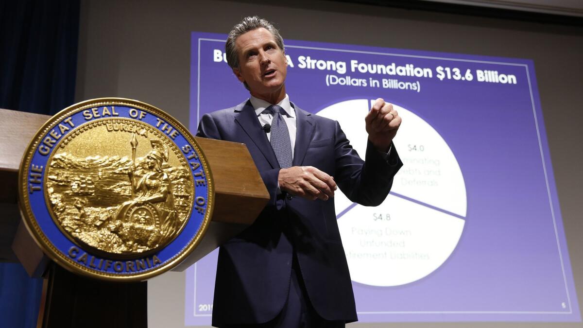 Gov. Gavin Newsom presents his first state budget during a news conference Thursday in Sacramento.