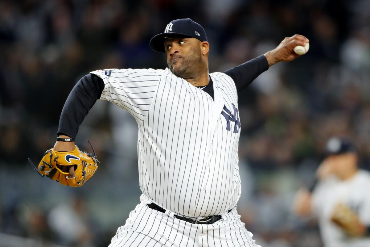 Yankees pitcher CC Sabathia pitches during Game 4 of the ALCS.