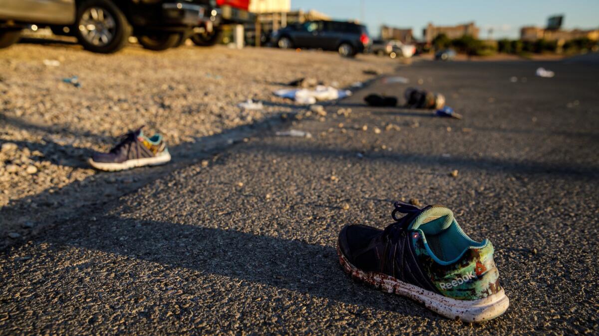 After the mass shooting in Las Vegas, personal items lie at the scene. Participants at a South L.A. rally are being encouraged to bring shoes belonging to or representing victims of gun violence.