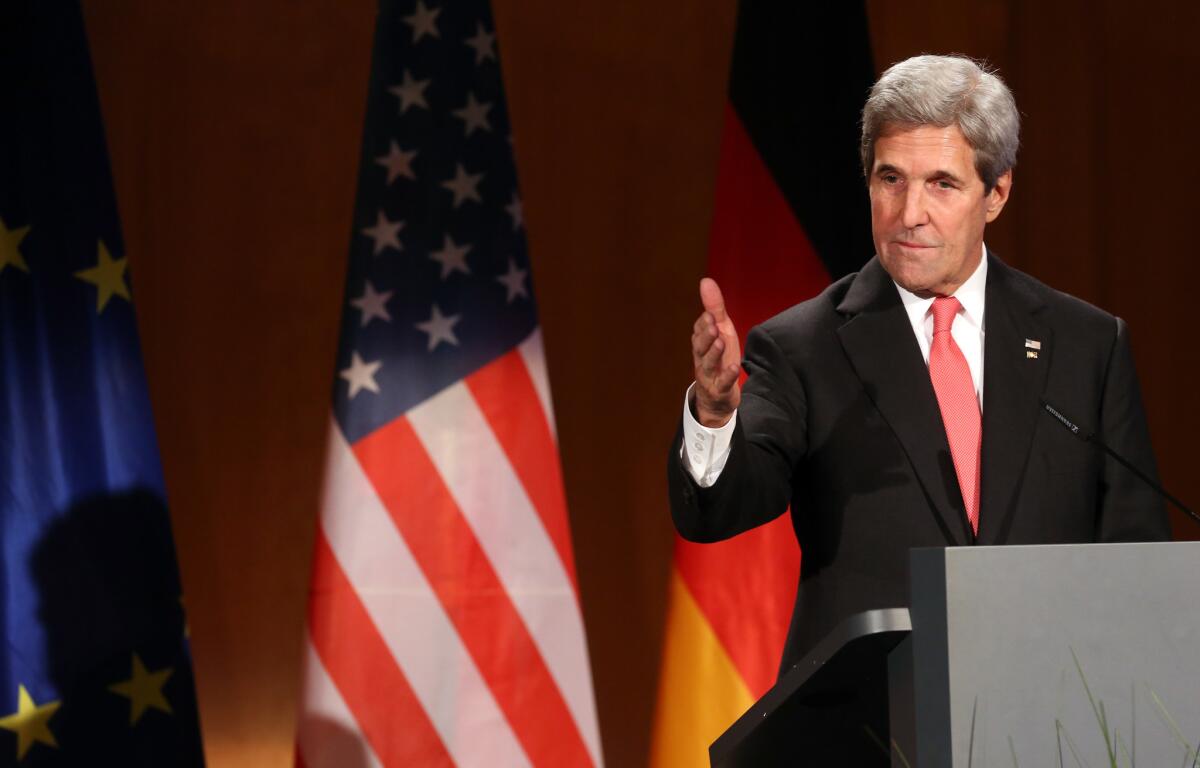 U.S. Secretary of State John Kerry speaks after receiving the Federal Cross of Merit award on December 5, 2016 in Berlin, Germany.
