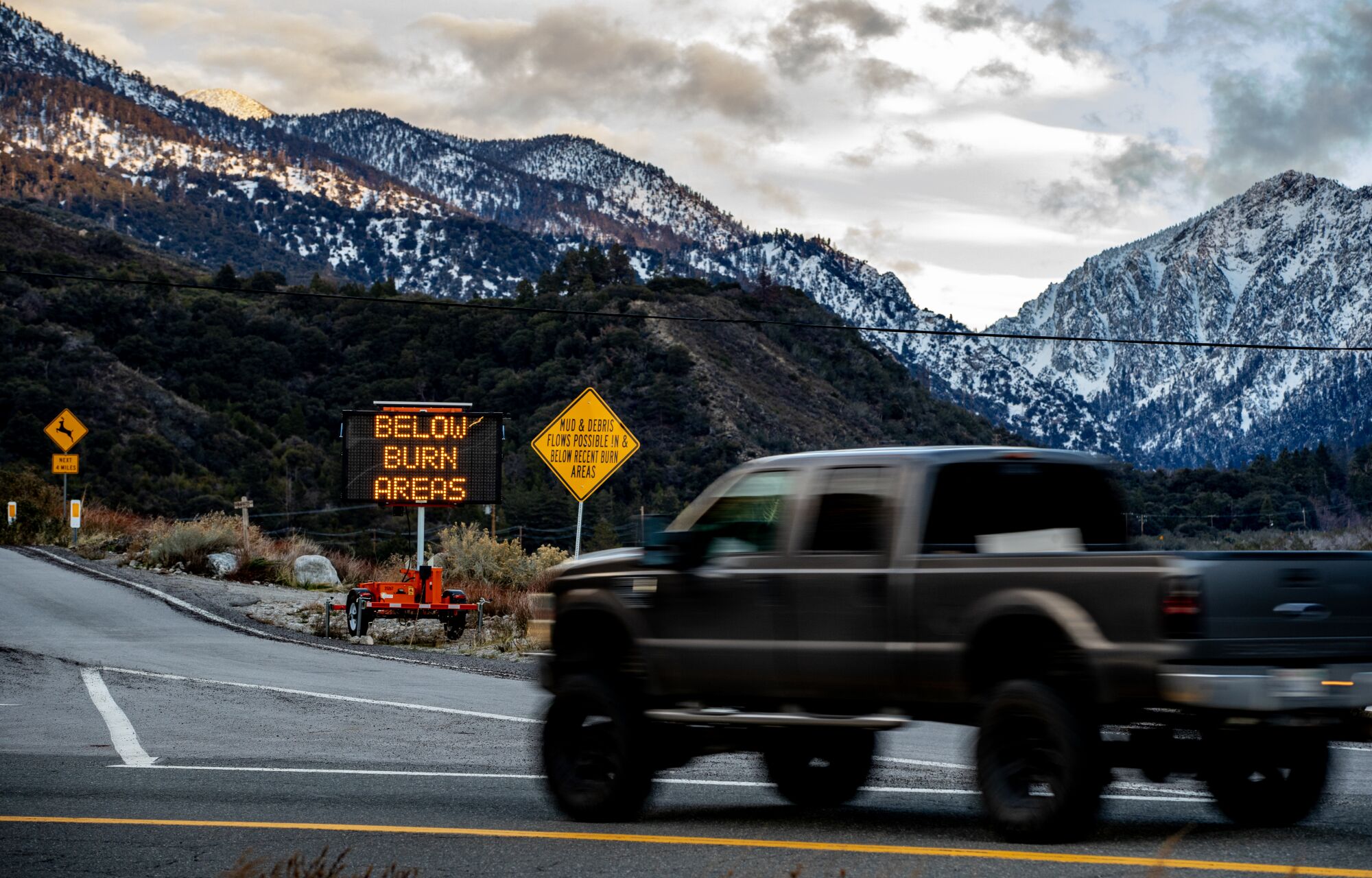 A sign warning of debris flows near Forest Falls in San Bernardino County.