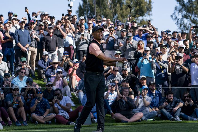 PACIFIC PALISADES, CA - FEBRUARY 13, 2020: Large crowds follow Tiger Woods as he tees off on hole 5 during Round 1 of the Genesis Open at Riviera Country Club on February 13, 2020 in Pacific Palisades, California. He shot a 69. (Gina Ferazzi/Los AngelesTimes)
