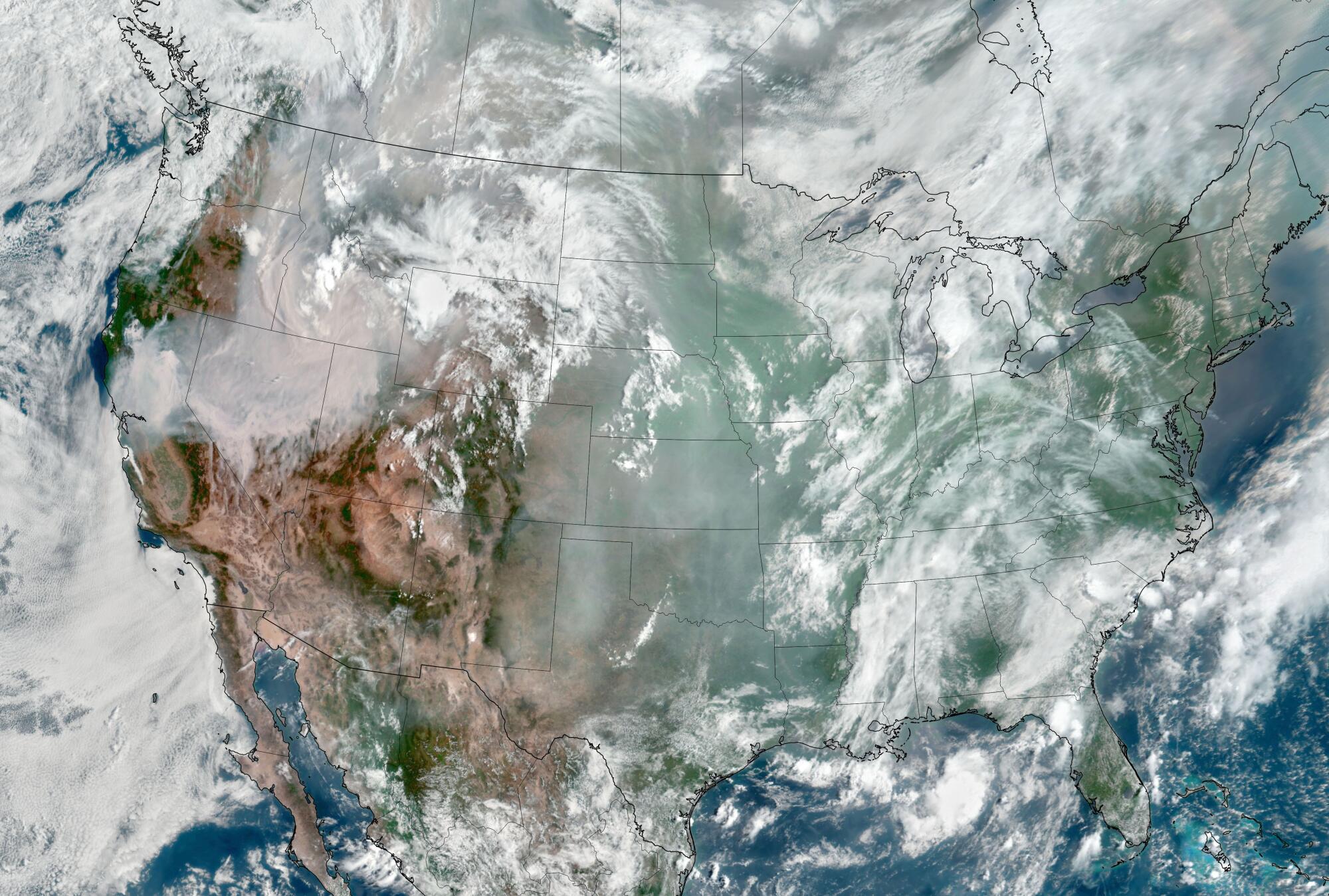 A satellite image shows smoke blanketing the western United States.