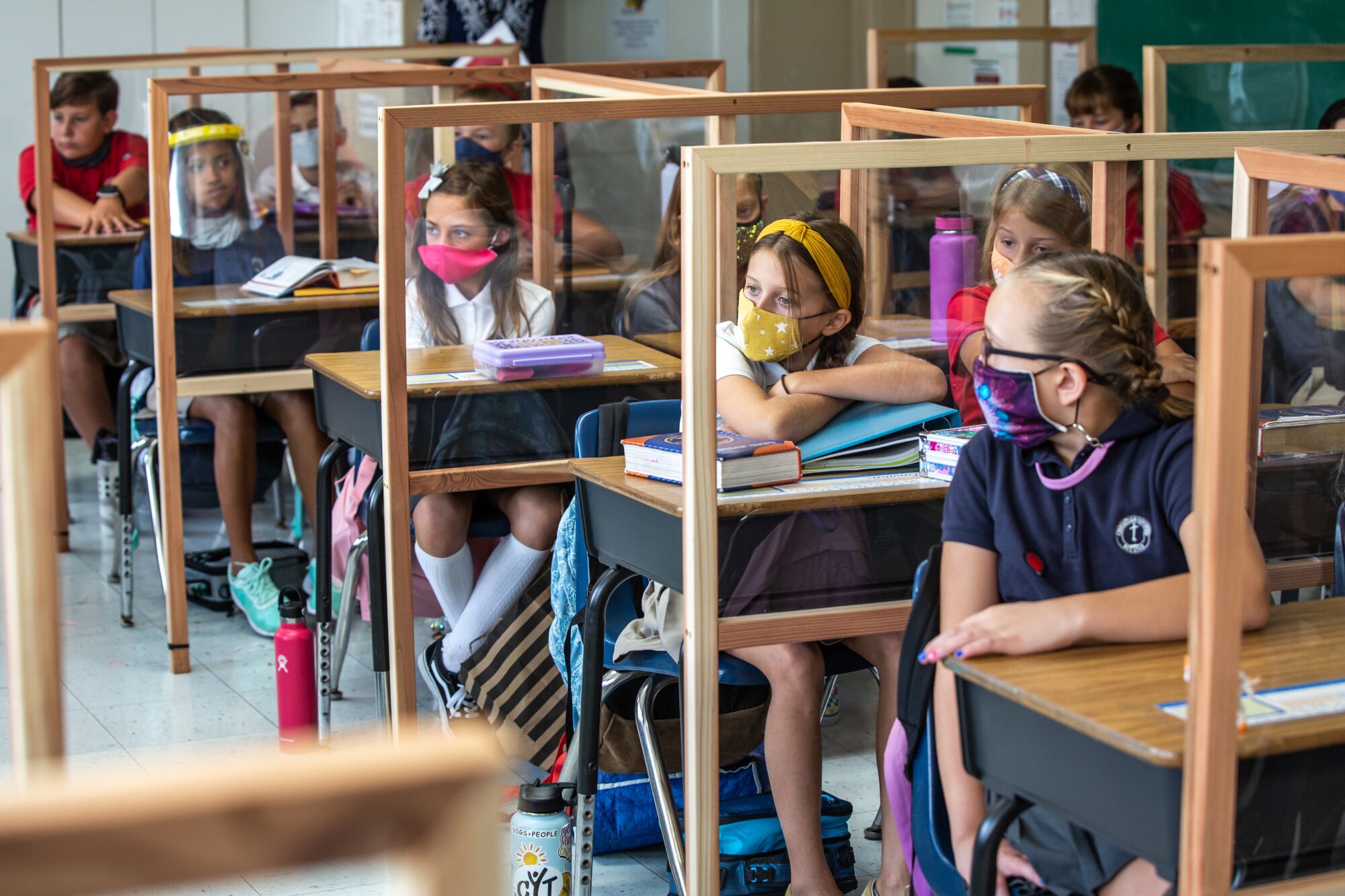 Plexiglass dividers separate students desks at Christian Unified East elementary school in El Cajon on Monday.