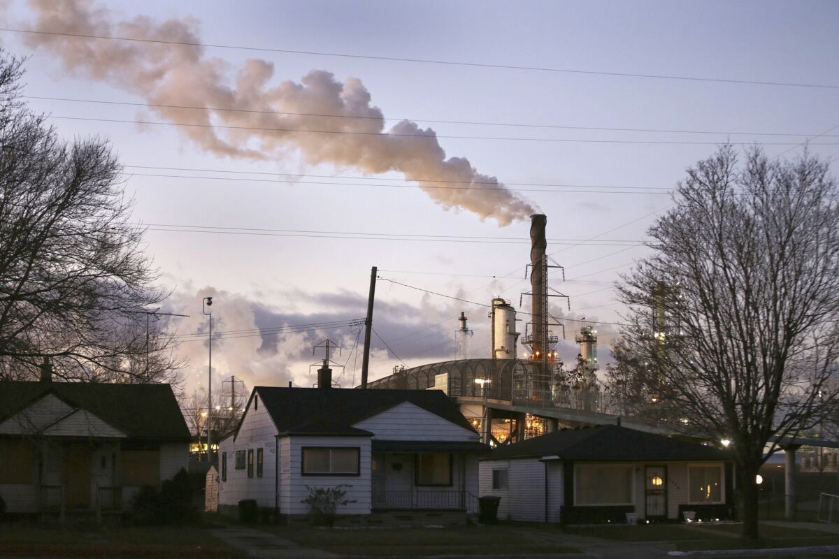 In an undated file photo, smoke billows from a Marathon Petroleum refinery near a neighborhood in southwest Detroit. One year after launching its Climate Funders Justice Pledge, The Donors of Color Network says it now has a $100 million funding baseline for environmental groups led by the minorities already disproportionately harmed by extreme weather events. The network also plans to announce Tuesday, April 5, 2022 that ClimateWorks Foundation will sign the full pledge, promising transparent reporting of their grants and to direct at least 30% of its climate funding grants to groups with Black, Indigenous or other people of color as their leaders. (Romain Blanquart/Detroit Free Press via AP)