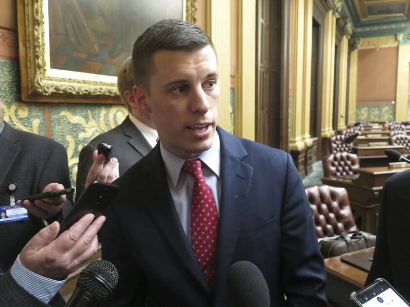 FILE - Michigan House Speaker Lee Chatfield, R-Levering, speaks with reporters following the House's approval of a bill that would cut auto insurance premiums on May 9, 2019, in the Capitol in Lansing, Mich. State police in northern Michigan were investigating Thursday, Jan. 6, 2022, after a woman accused former state House Speaker Lee Chatfield of sexually assaulting her multiple times, beginning when she was about 14 years old. The accuser, now 26, filed a criminal complaint with the Lansing Police Department, which referred it to state police earlier this week. Chatfield, 33, left the House in 2020 due to term limits (AP Photo/David Eggert, File)