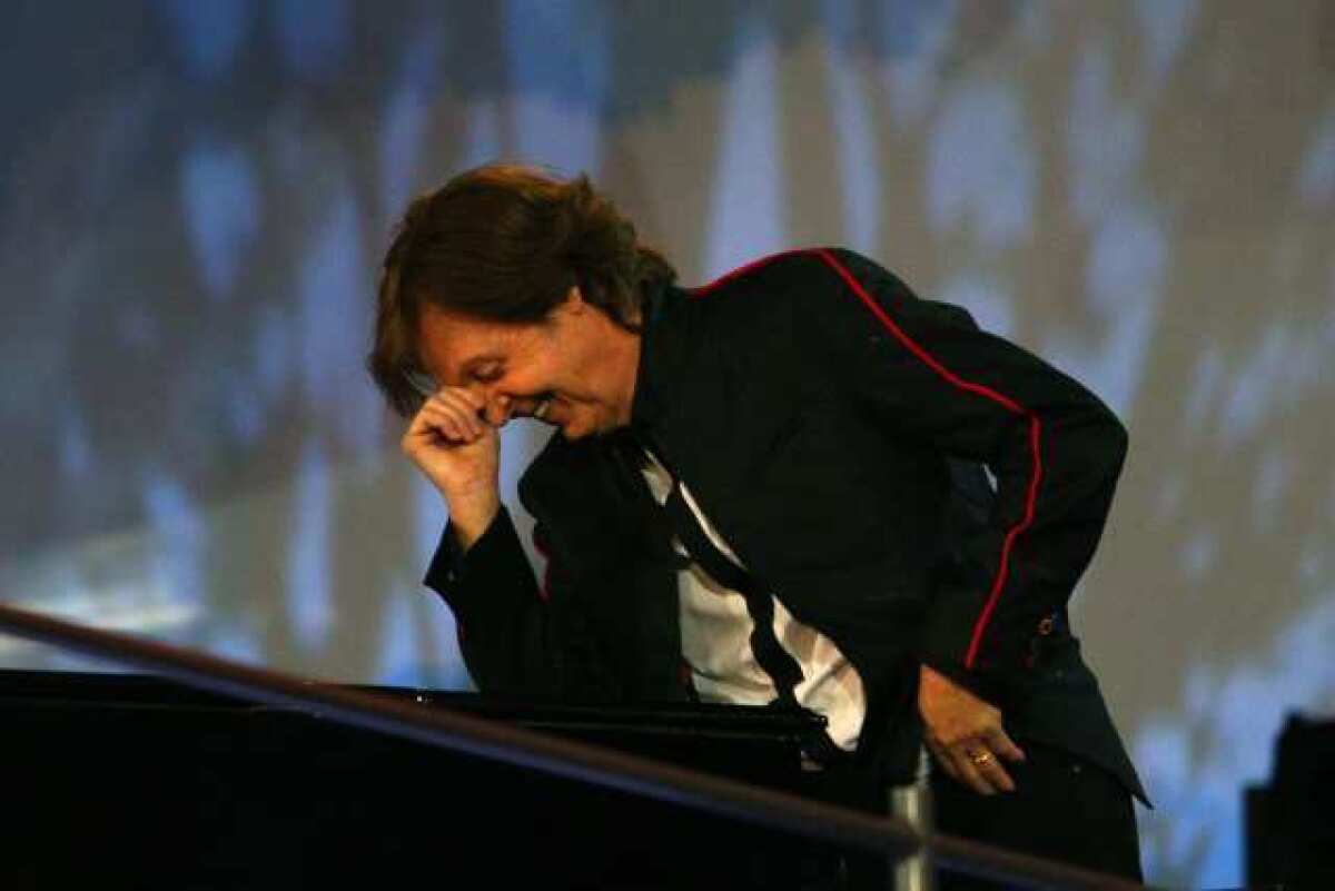 Paul McCartney performs during the opening ceremony of the London Olympics.