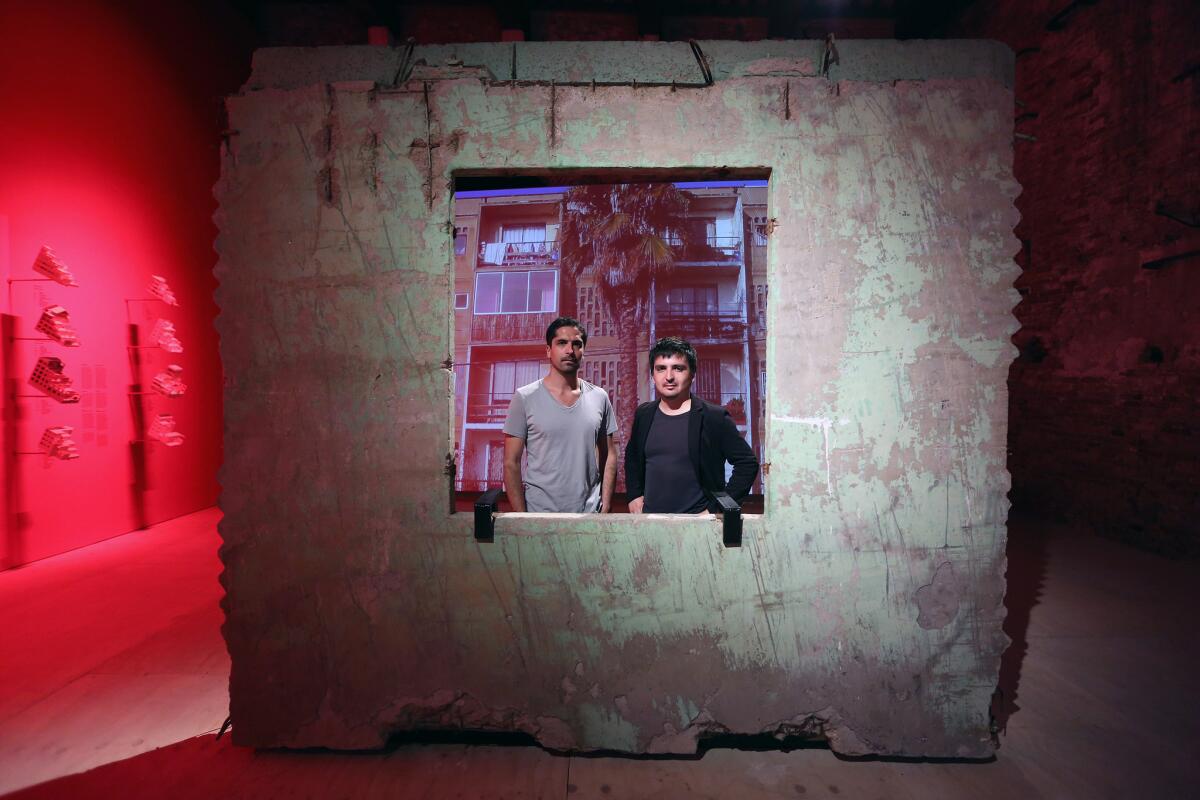 Architects Pedro Alonso and Hugo Palmarola at the opening of their pavilion at the 14th Venice Architecture Biennale in 2014. The pair took home a Silver Lion for an installation that explored pre-fab housing experiments in Chile.