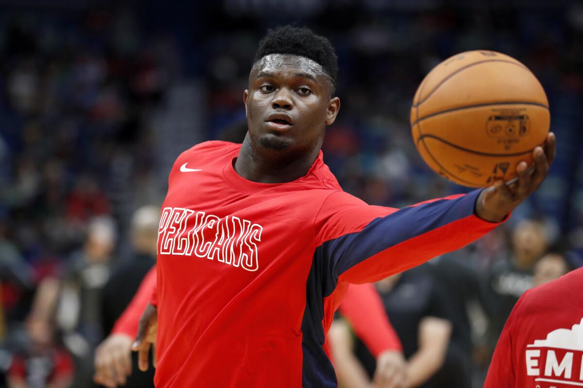 New Orleans Pelicans forward Zion Williamson warms up before a preseason game against the Utah Jazz on Oct. 11.