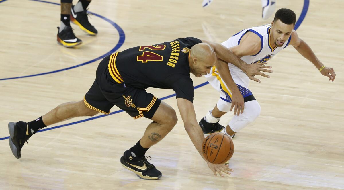 Cavaliers forward Richard Jefferson steals the ball from Warriors guard Stephen Curry in the first half of Game 7.